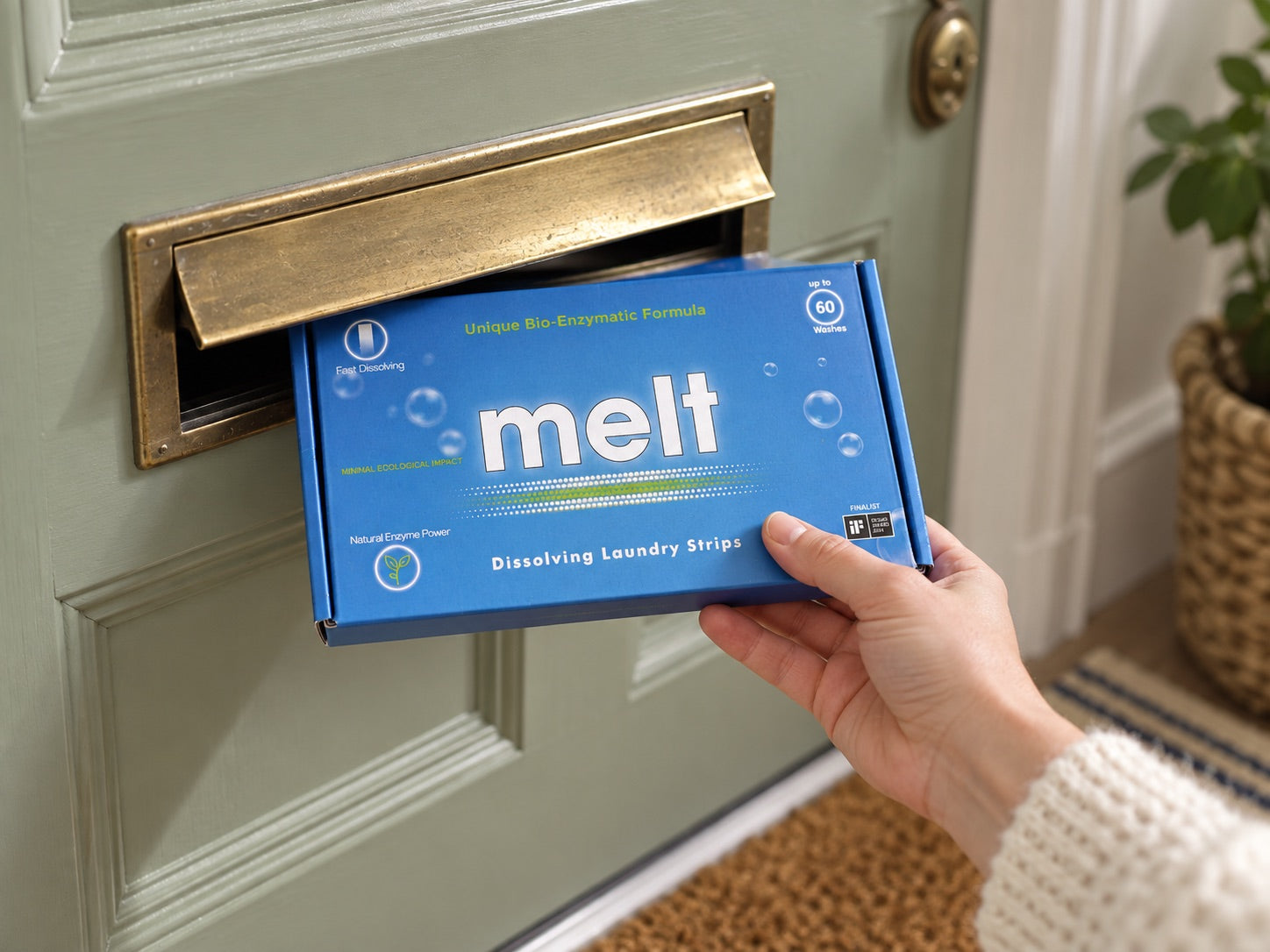 A slim Melt laundry pack arriving through a letterbox